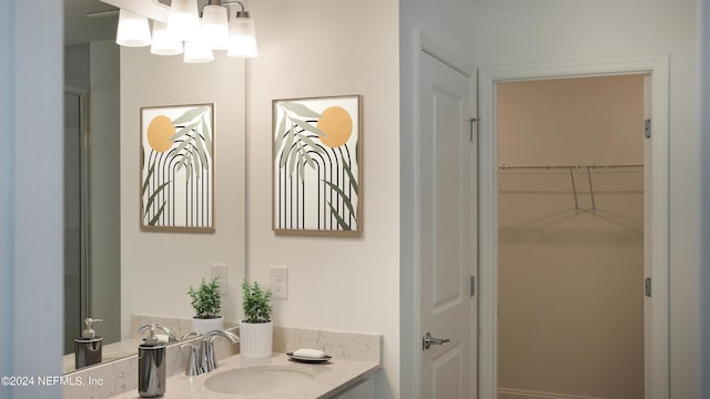 324 Higgins Loop, Saint Augustine, FL 32092 - full bath with vanity, a chandelier, and a spacious closet