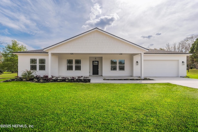 1861 Openwoods Rd, Middleburg, FL 32068 - view of front of house with a garage, concrete driveway, a front yard, and covered porch