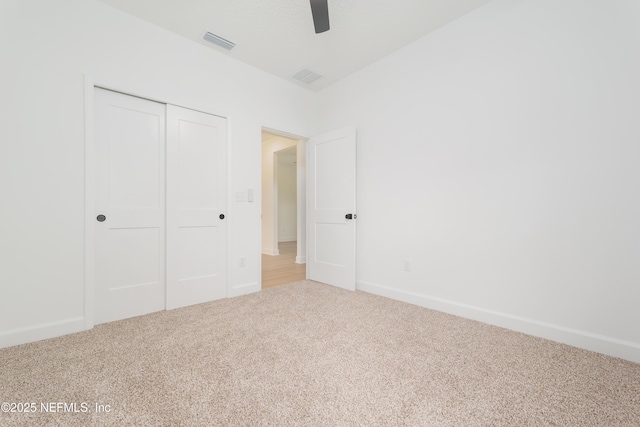 1861 Openwoods Rd, Middleburg, FL 32068 - unfurnished bedroom with carpet, a closet, and a ceiling fan