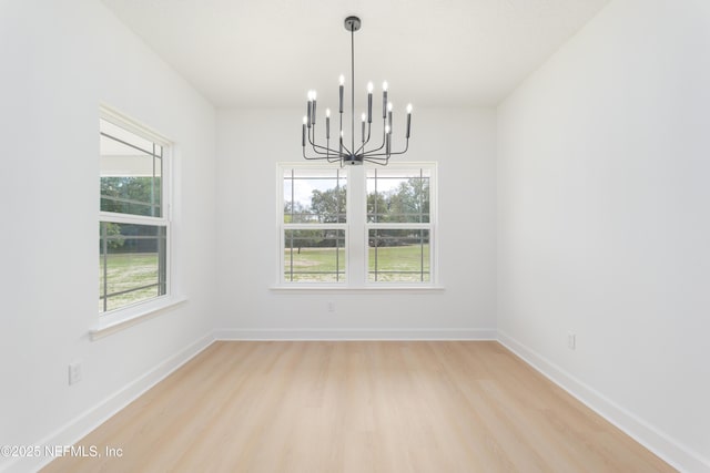 1861 Openwoods Rd, Middleburg, FL 32068 - empty room featuring a chandelier and light wood-style floors