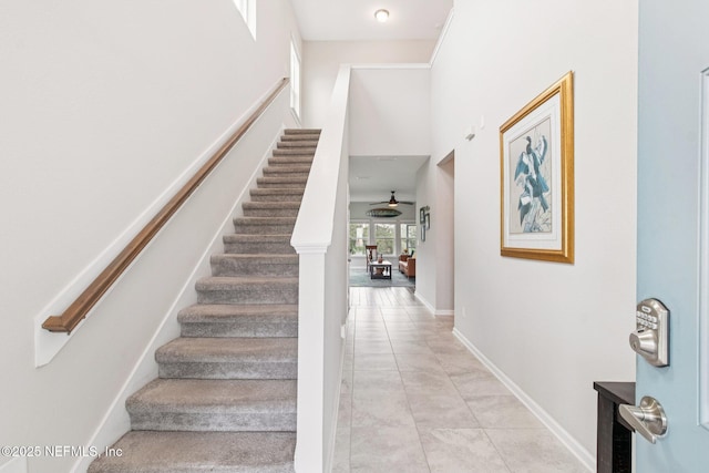 148 Ancient Island Dr, Saint Augustine, FL 32080 - stairway with baseboards and a high ceiling