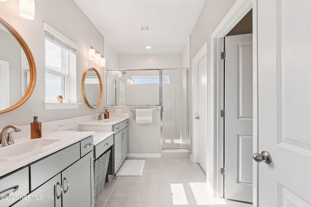 148 Ancient Island Dr, Saint Augustine, FL 32080 - bathroom featuring double vanity, a shower stall, and tile patterned floors