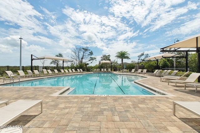 148 Ancient Island Dr, Saint Augustine, FL 32080 - community pool featuring a patio area