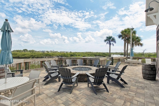 148 Ancient Island Dr, Saint Augustine, FL 32080 - view of patio featuring a fire pit and outdoor dining space