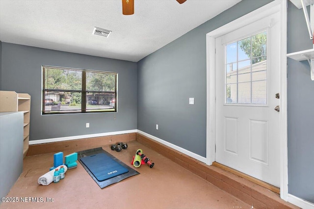 455 Aiken Rd, Jacksonville, FL 32216 - workout area featuring healthy amount of natural light, ceiling fan, and a textured ceiling