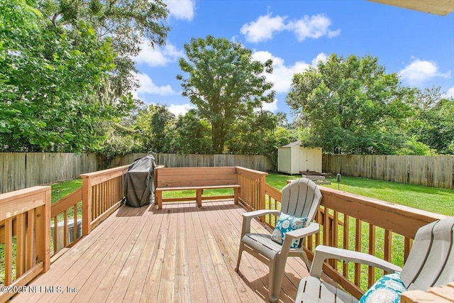 455 Aiken Rd, Jacksonville, FL 32216 - wooden terrace with a storage unit, a fenced backyard, and grilling area