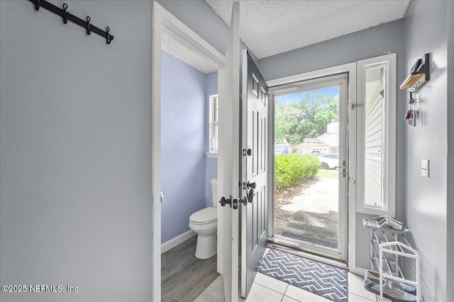 7632 Rain Forest Dr W, Jacksonville, FL 32277 - bathroom featuring toilet and a textured ceiling