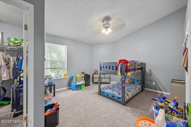 7632 Rain Forest Dr W, Jacksonville, FL 32277 - bedroom featuring a textured ceiling, carpet flooring, a closet, and a ceiling fan