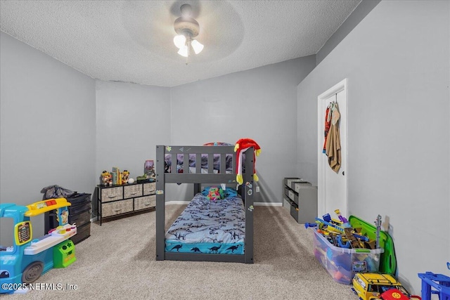 7632 Rain Forest Dr W, Jacksonville, FL 32277 - carpeted bedroom with a textured ceiling and ceiling fan