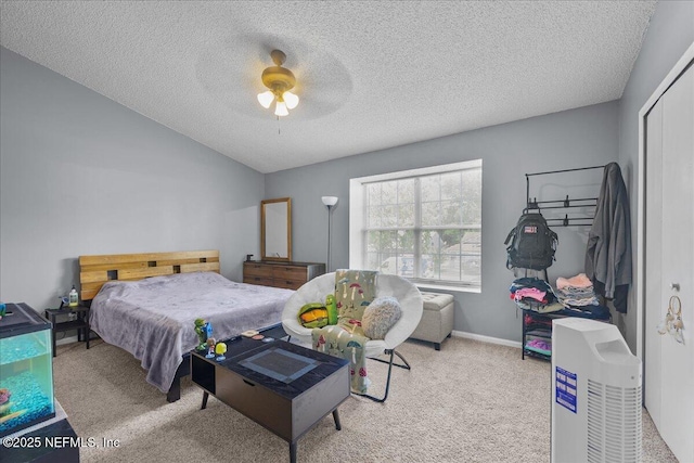 7632 Rain Forest Dr W, Jacksonville, FL 32277 - carpeted bedroom with a textured ceiling and ceiling fan