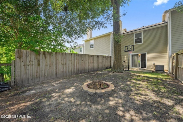 7632 Rain Forest Dr W, Jacksonville, FL 32277 - fenced backyard with an outdoor fire pit