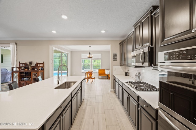 121 Seamount Way, Saint Augustine, FL 32092 - kitchen with stainless steel appliances, light countertops, ornamental molding, backsplash, and recessed lighting