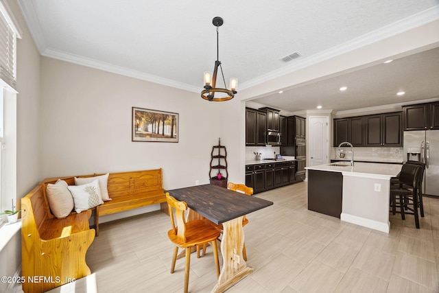 121 Seamount Way, Saint Augustine, FL 32092 - dining space featuring a chandelier, ornamental molding, and recessed lighting