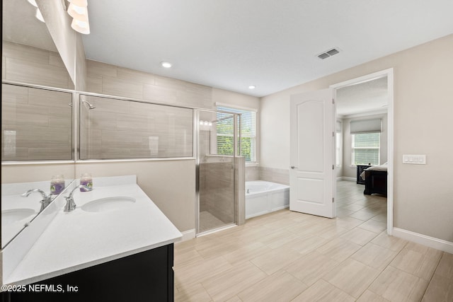121 Seamount Way, Saint Augustine, FL 32092 - ensuite bathroom with healthy amount of natural light, a bath, vanity, a shower stall, and recessed lighting
