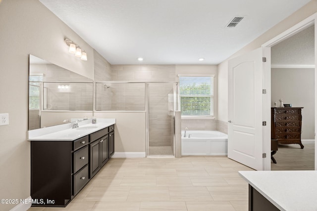 121 Seamount Way, Saint Augustine, FL 32092 - bathroom with vanity, a garden tub, and a stall shower