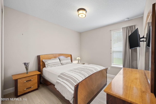 121 Seamount Way, Saint Augustine, FL 32092 - bedroom with multiple windows and a textured ceiling