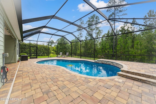 121 Seamount Way, Saint Augustine, FL 32092 - outdoor pool featuring a patio area and glass enclosure