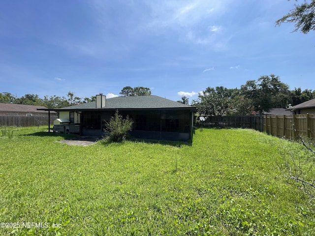 1038 Celebrant Dr, Jacksonville, FL 32225 - rear view of property featuring a sunroom, a shingled roof, and a chimney
