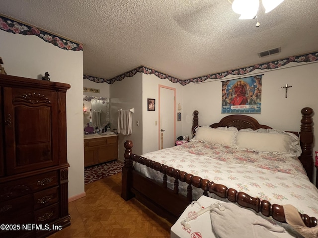 1038 Celebrant Dr, Jacksonville, FL 32225 - bedroom featuring a textured ceiling and ensuite bathroom