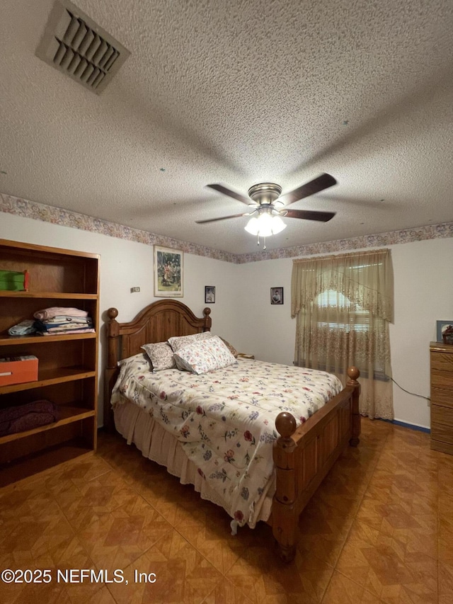 1038 Celebrant Dr, Jacksonville, FL 32225 - bedroom featuring a textured ceiling and a ceiling fan