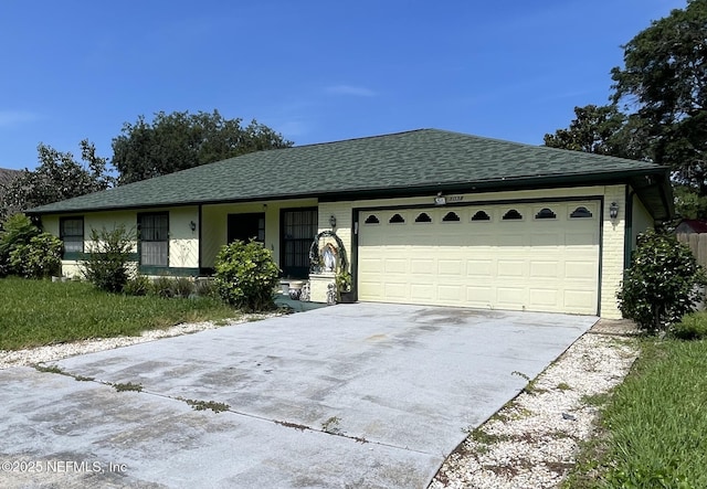 1038 Celebrant Dr, Jacksonville, FL 32225 - single story home featuring driveway, an attached garage, roof with shingles, and brick siding