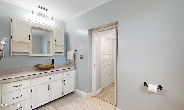 5110 Janice Cir E, Jacksonville, FL 32210 - bathroom featuring vanity, marble finish flooring, ornamental molding, and a closet