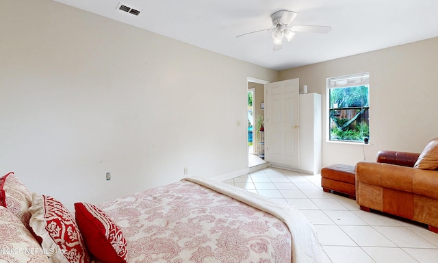 5110 Janice Cir E, Jacksonville, FL 32210 - bedroom featuring light tile patterned flooring and a ceiling fan