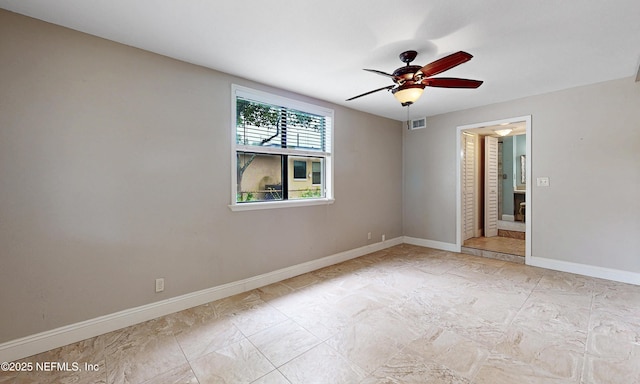 5110 Janice Cir E, Jacksonville, FL 32210 - empty room with a ceiling fan and baseboards