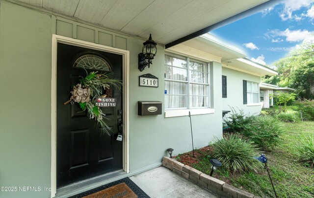 5110 Janice Cir E, Jacksonville, FL 32210 - property entrance featuring stucco siding
