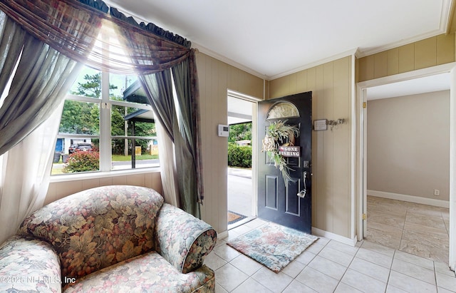 5110 Janice Cir E, Jacksonville, FL 32210 - entryway featuring crown molding, plenty of natural light, light tile patterned floors, and wood walls