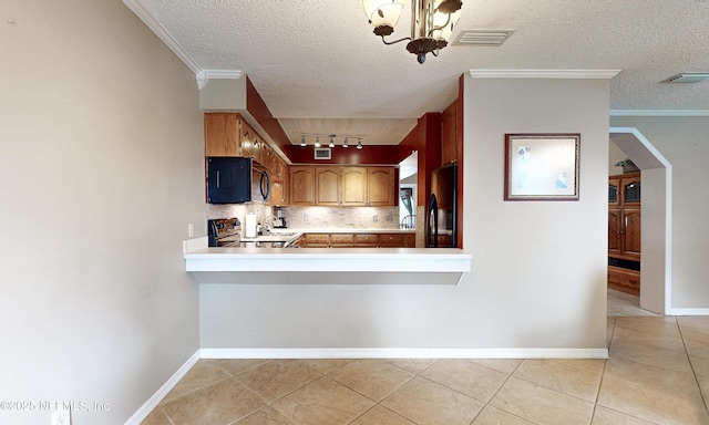 5110 Janice Cir E, Jacksonville, FL 32210 - kitchen featuring black appliances, backsplash, light tile patterned floors, light countertops, and a textured ceiling