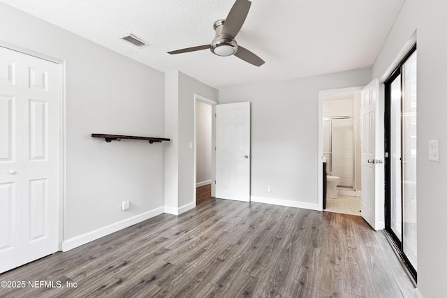 3349 Gilmore St, Jacksonville, FL 32205 - unfurnished bedroom with wood finished floors, a ceiling fan, ensuite bathroom, and a closet