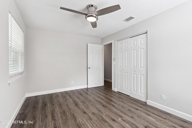 3349 Gilmore St, Jacksonville, FL 32205 - unfurnished bedroom featuring wood finished floors, a closet, and ceiling fan