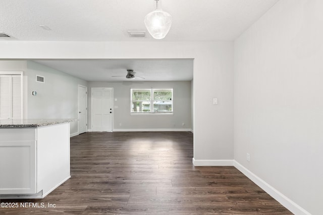 3349 Gilmore St, Jacksonville, FL 32205 - unfurnished living room featuring ceiling fan and dark wood-type flooring