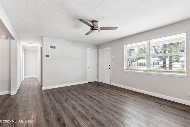 3349 Gilmore St, Jacksonville, FL 32205 - foyer featuring ceiling fan, a textured ceiling, and dark wood-type flooring