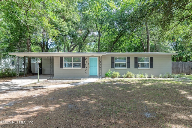 3349 Gilmore St, Jacksonville, FL 32205 - ranch-style house featuring a carport and driveway