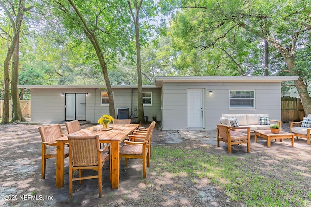 3349 Gilmore St, Jacksonville, FL 32205 - rear view of property featuring outdoor lounge area, a patio, and outdoor dining space