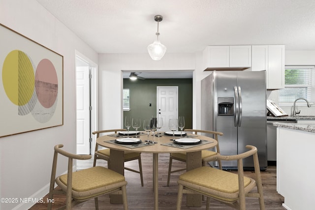 3349 Gilmore St, Jacksonville, FL 32205 - dining area featuring wood finished floors and a textured ceiling