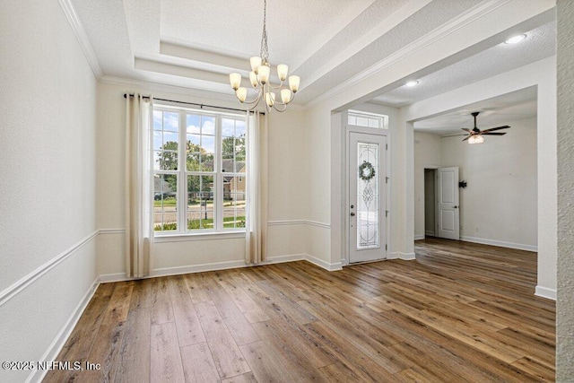 1103 Orchard Oriole Pl, Middleburg, FL 32068 - spare room with a chandelier, wood-type flooring, ornamental molding, and a ceiling fan