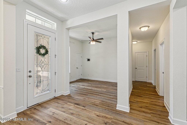 1103 Orchard Oriole Pl, Middleburg, FL 32068 - entrance foyer featuring wood finished floors, ceiling fan, and a textured ceiling