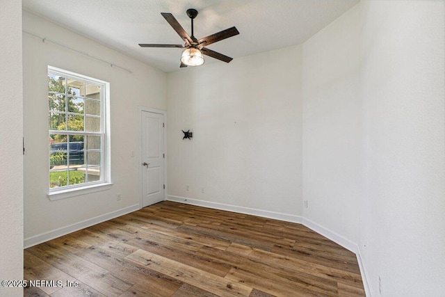 1103 Orchard Oriole Pl, Middleburg, FL 32068 - unfurnished room featuring healthy amount of natural light, wood finished floors, and ceiling fan