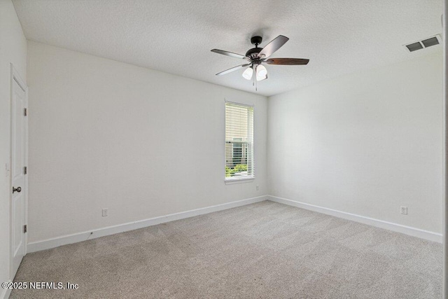 1103 Orchard Oriole Pl, Middleburg, FL 32068 - unfurnished room featuring a ceiling fan, light carpet, and a textured ceiling