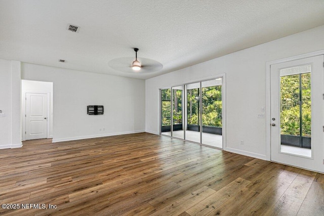 1103 Orchard Oriole Pl, Middleburg, FL 32068 - unfurnished room with healthy amount of natural light, ceiling fan, and hardwood / wood-style flooring