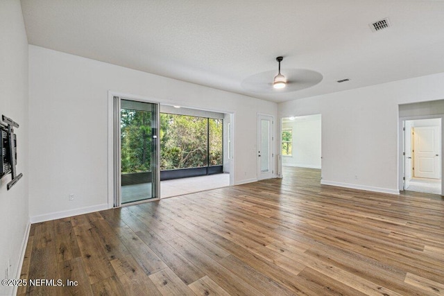 1103 Orchard Oriole Pl, Middleburg, FL 32068 - unfurnished living room with hardwood / wood-style floors and ceiling fan