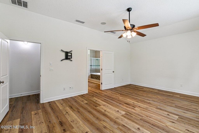 1103 Orchard Oriole Pl, Middleburg, FL 32068 - unfurnished bedroom with wood finished floors, a spacious closet, and ensuite bathroom