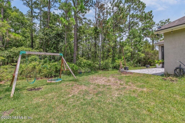1103 Orchard Oriole Pl, Middleburg, FL 32068 - view of green lawn featuring a playground and a patio area