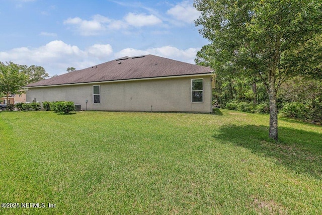 1103 Orchard Oriole Pl, Middleburg, FL 32068 - view of side of property featuring a yard and stucco siding