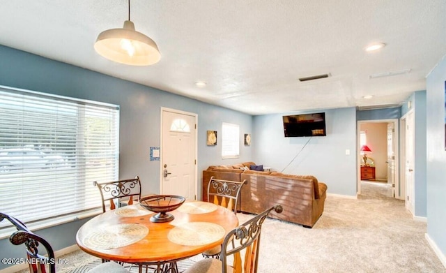 1922 Locust Ave, Palatka, FL 32177 - dining area with light colored carpet and recessed lighting