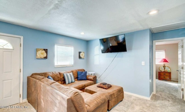 1922 Locust Ave, Palatka, FL 32177 - living area featuring carpet, plenty of natural light, a textured ceiling, and recessed lighting
