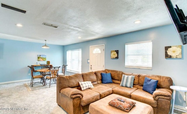 1922 Locust Ave, Palatka, FL 32177 - living area with a textured ceiling, light carpet, and recessed lighting